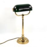 A brass student's desk lamp with green glass shade, height 46cm, modern