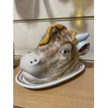 A Majolica pottery bull's head design cheese dish and cover, early 20th century, base length 25cm