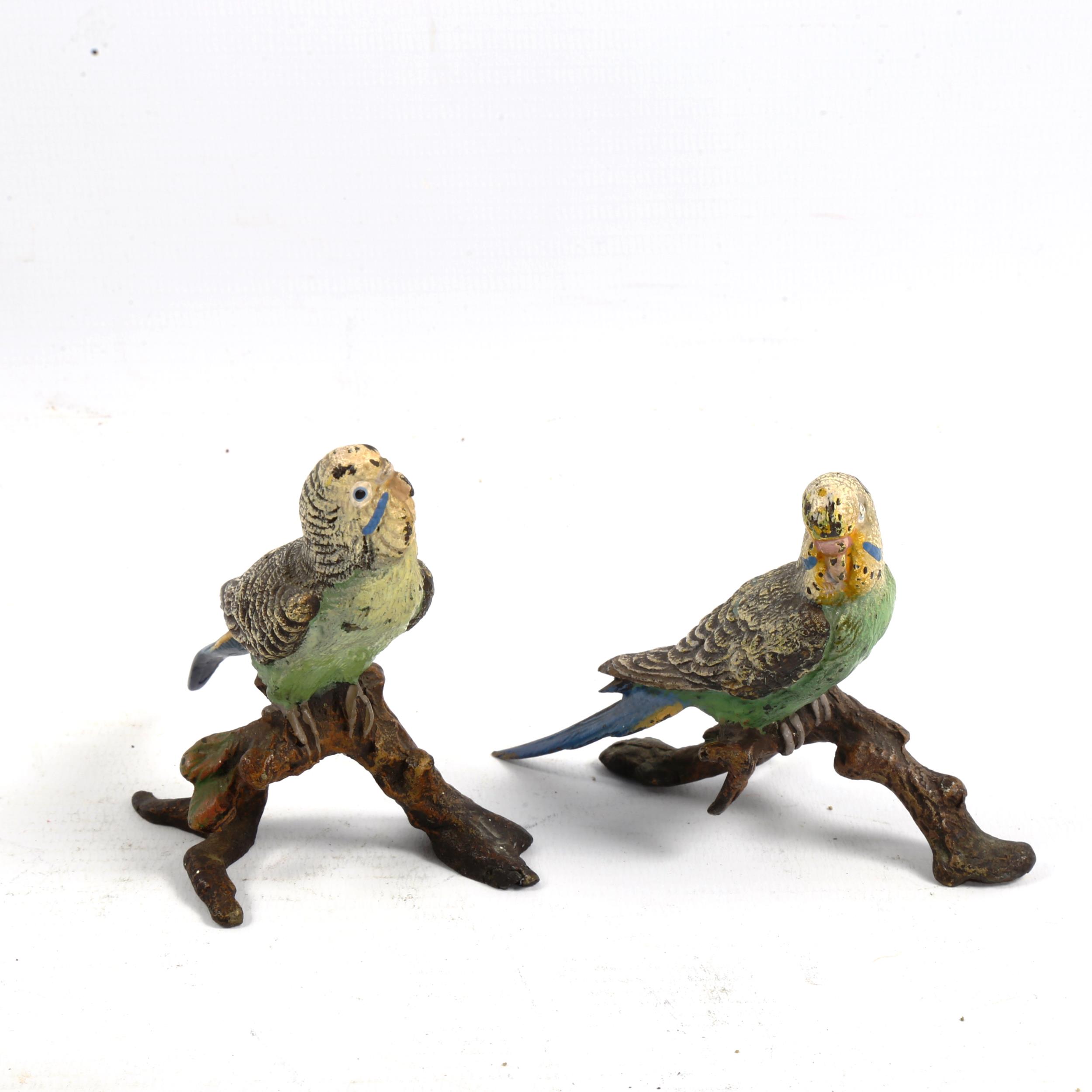 A pair of Austrian cold painted bronze lovebirds on branches, height 8cm