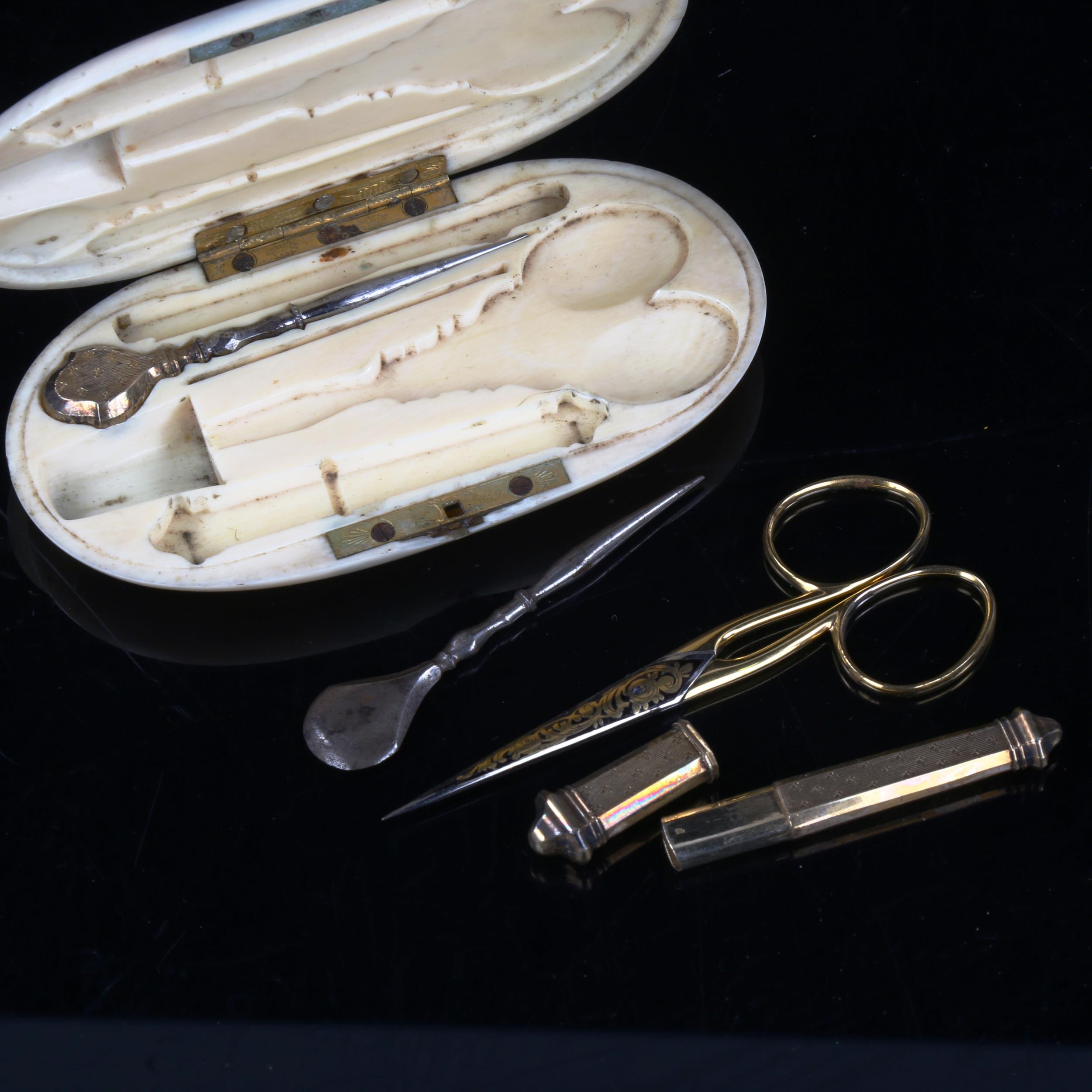 A 19th century ivory sewing etui, containing gilded scissors, needle case etc, case length 11cm - Image 3 of 3