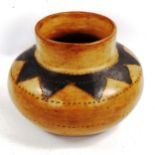 A Zimbabwe handmade terracotta vase, with painted shoulders and incised decoration, overall diameter
