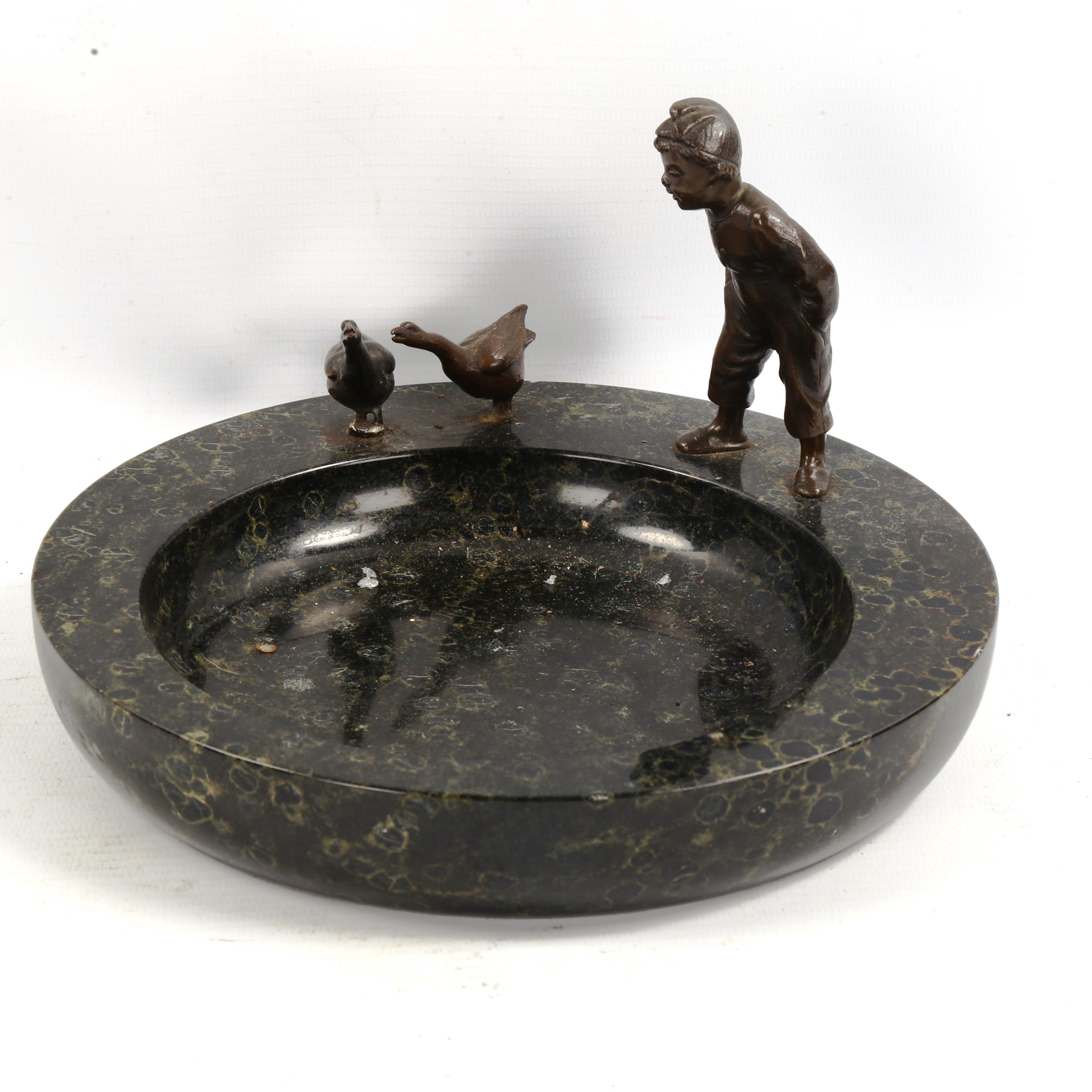 A marble bowl surmounted by bronze boy and geese, early 20th century, diameter 21cm