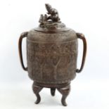 A Chinese patinated bronze vase and cover, surmounted by a rat and fruit, relief moulded surround,