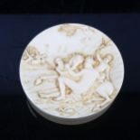 A circular ivory box with relief carved lid depicting Classical figures and horses, 18th or 19th