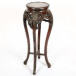 A Chinese rosewood jardiniere stand, late 19th century, with inset marble top and carved and pierced