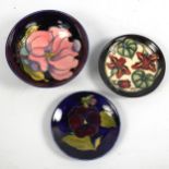MOORCROFT POTTERY - a Magnolia design bowl, diameter 14cm, and 2 other small Moorcroft Potter pin