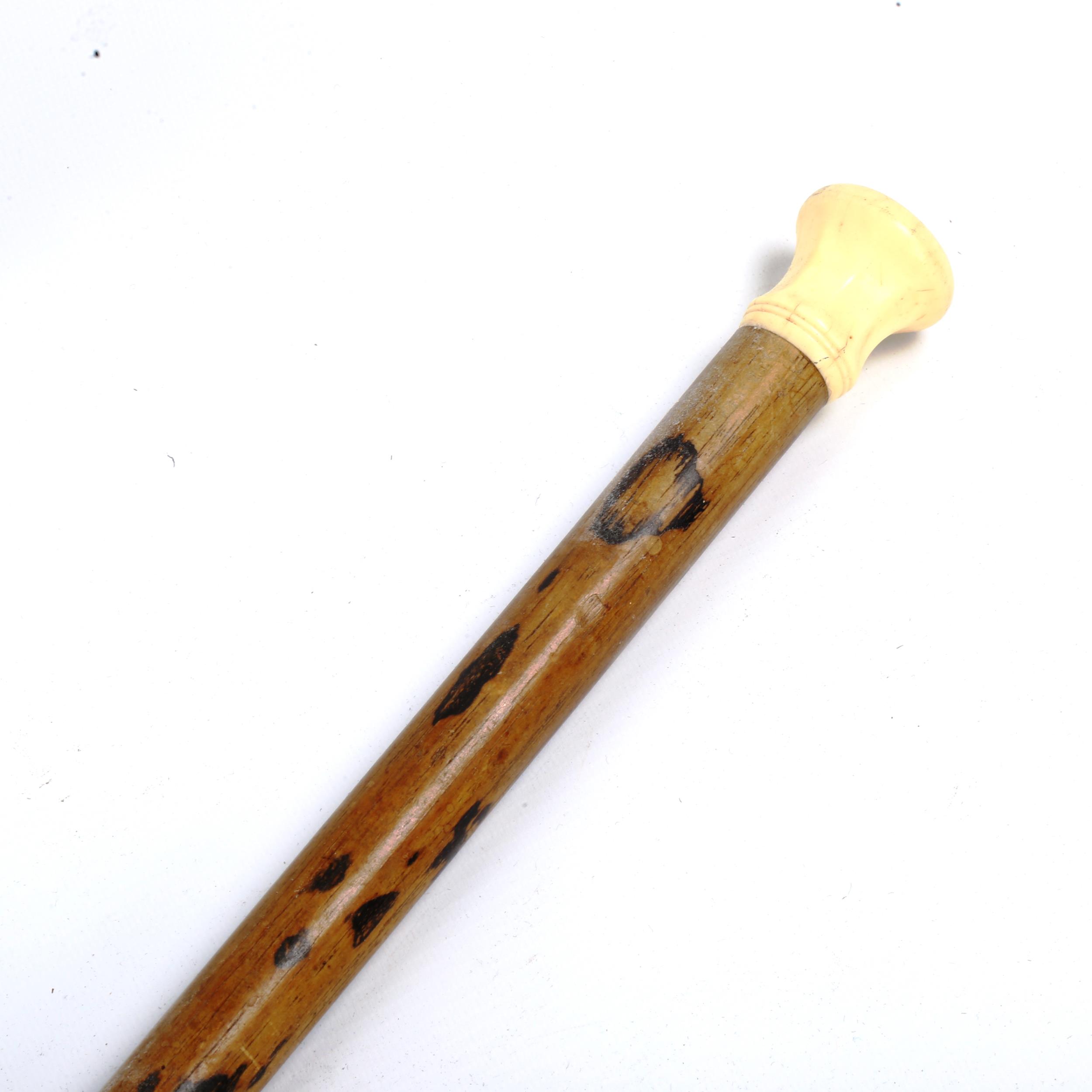 An 18th/19th century ivory-handled walking cane, with seal top