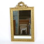 A 19th century giltwood and gesso-framed wall mirror, with floral pediment, overall height 112cm,