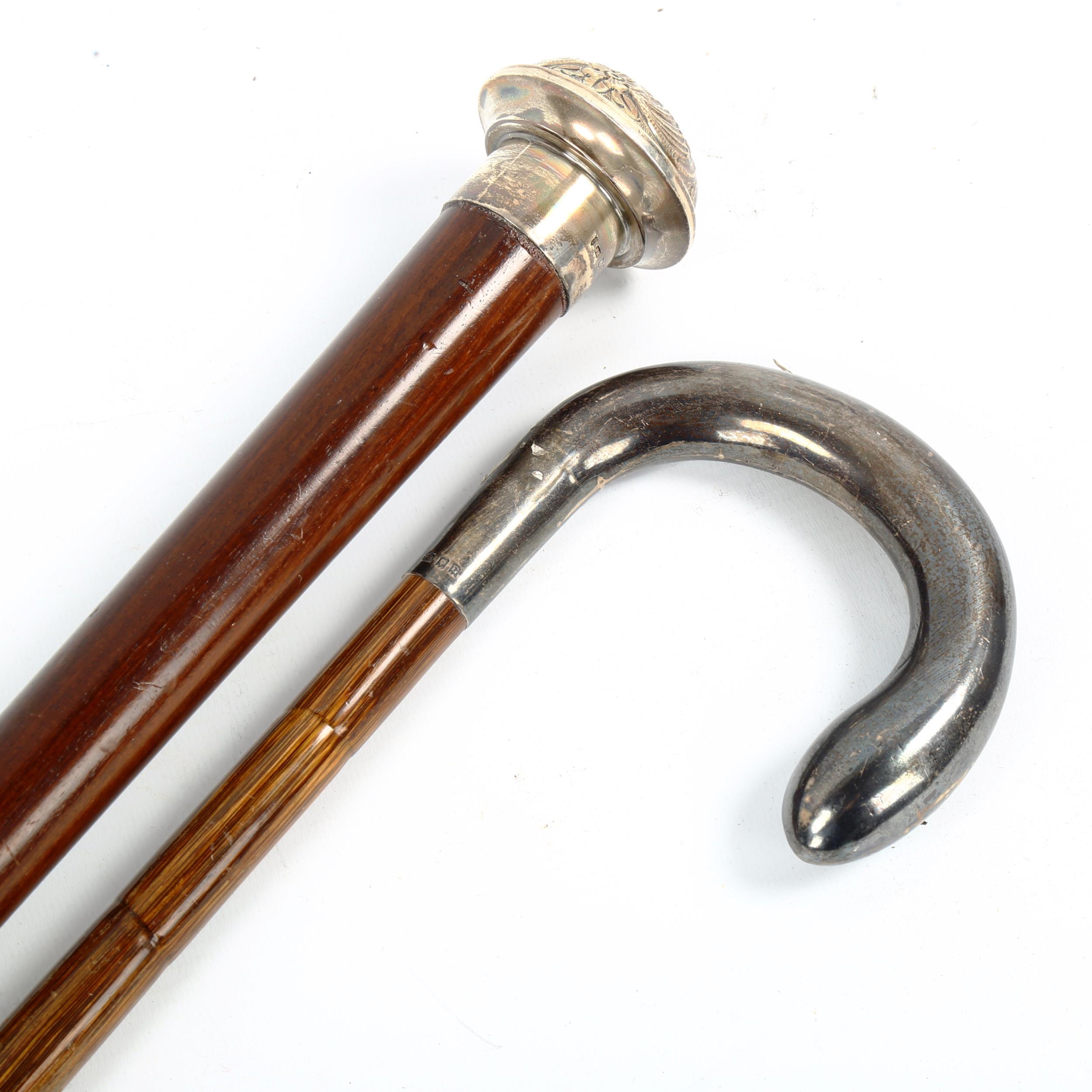 2 hallmarked silver-topped walking canes