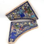 A pair of Islamic pottery over-door tiles, with hand painted musical scenes, each tile width 38cm,