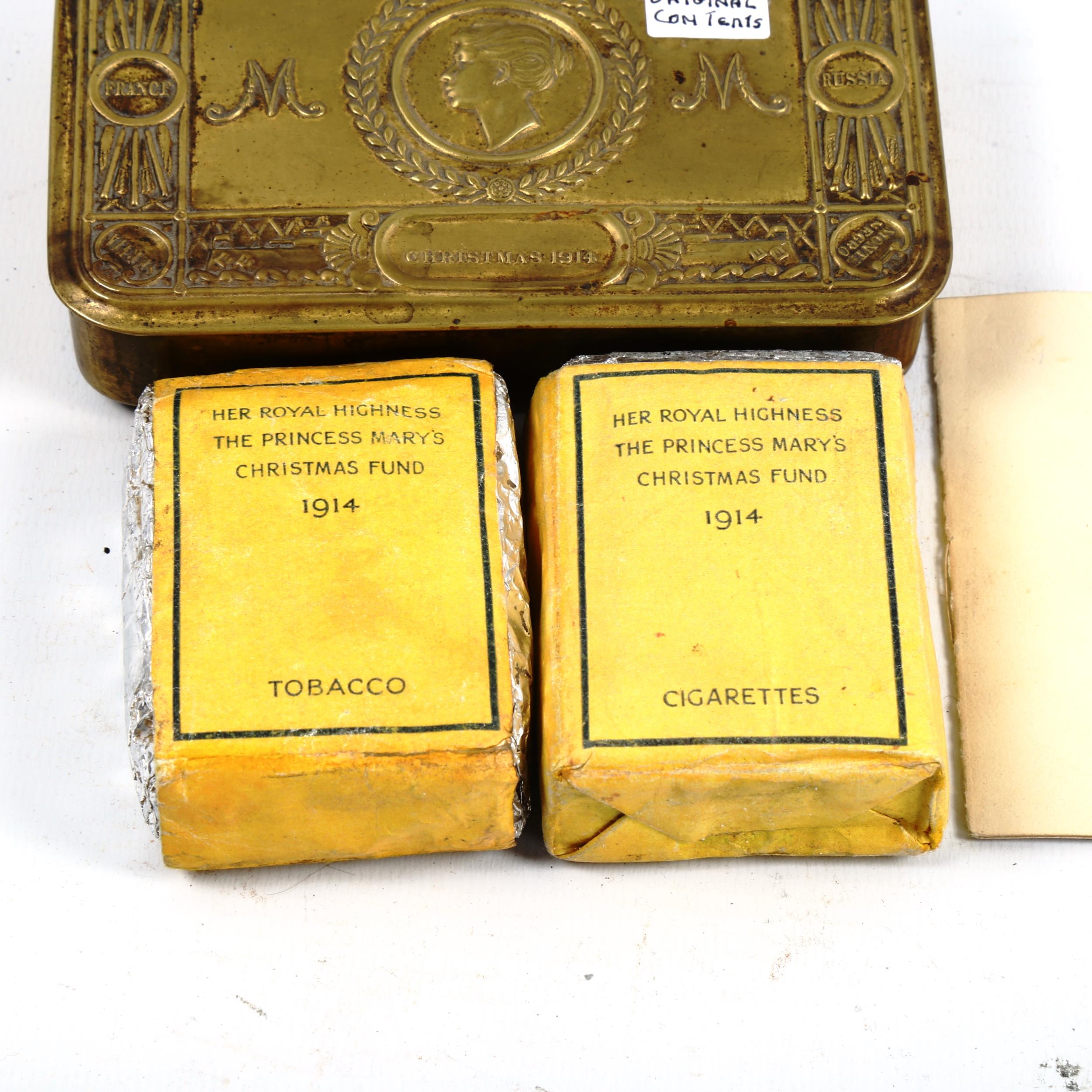 A 1914 Princess Mary Christmas tin, containing original tobacco, cigarettes and card - Image 2 of 3