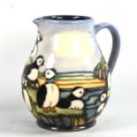 MOORCROFT POTTERY - a Puffin design jug, 1997, height 14.5cm, boxed