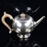 An Edward VIII silver bullet teapot, in 18th century style, with turned wood mounts, by Wakely &