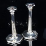 A pair of Art Deco George V silver octagonal table candlesticks, with removeable sconces, height