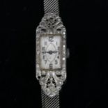 A lady's Art Deco 18ct white gold diamond mechanical cocktail wristwatch, rectangular silvered