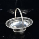 A George V silver swing-handled bon bon basket, with gadrooned rim and pierced gallery, by Edward