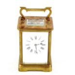 A French brass-cased carriage clock, white enamel dial with Roman numeral hour markers and