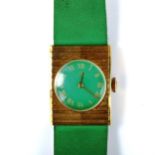 BUCHERER - a lady's gold plated stainless steel mechanical wristwatch, green dial with gilded