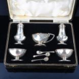 A cased George V silver 5-piece cruet set, comprising mustard pot, pair of pepperettes and pair of