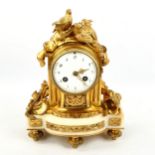 A small 19th century French ormolu and white marble 8-day mantel clock, white enamel dial with