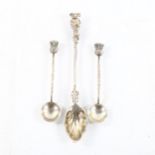 A pair of sterling silver thistle design spoons, and a sterling silver spoon with animal finial (