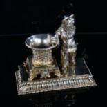A good quality French gilt-bronze match stand/lighter, in the form of a Pierrot magician and basket,