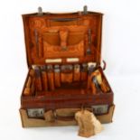 An Edwardian crocodile skin travelling case, by Mansfield and Sons of Dublin, with original silver-