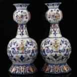 A pair of Dutch Delft pottery polychrome vases, signed under base, height 31cm, A/F