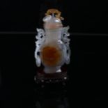 A Chinese jade/agate square-section vase and cover, carved from a single piece of hardstone, with