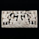 An 18th century or earlier relief carved and pierced ivory plaque, depicting a religious group,