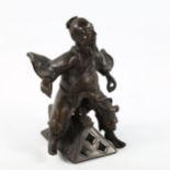 A Japanese bronze figure of a man, on associated dragon design stand, height 17cm