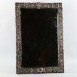 A Victorian cast silver-mounted dressing table strut mirror, on ebonised backing, hallmarks London