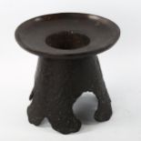 A Japanese bronze Ikebana vase and stand, relief moulded text to the base, diameter 22cm, height
