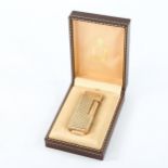 DUNHILL - a 14ct gold pocket lighter in Austrian woven textured design, marked 585, length 6.5cm,