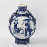 A Chinese blue and white porcelain moon-shaped vase, with painted panels, height 22cm, rim broken