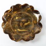 A 19th century Japanese tortoiseshell dish of scalloped circular form, relief moulded gold lacquer