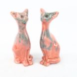 A pair of small Barnstaple pottery seated cats with mottled pink glaze, height 11cm - BBC Antiques