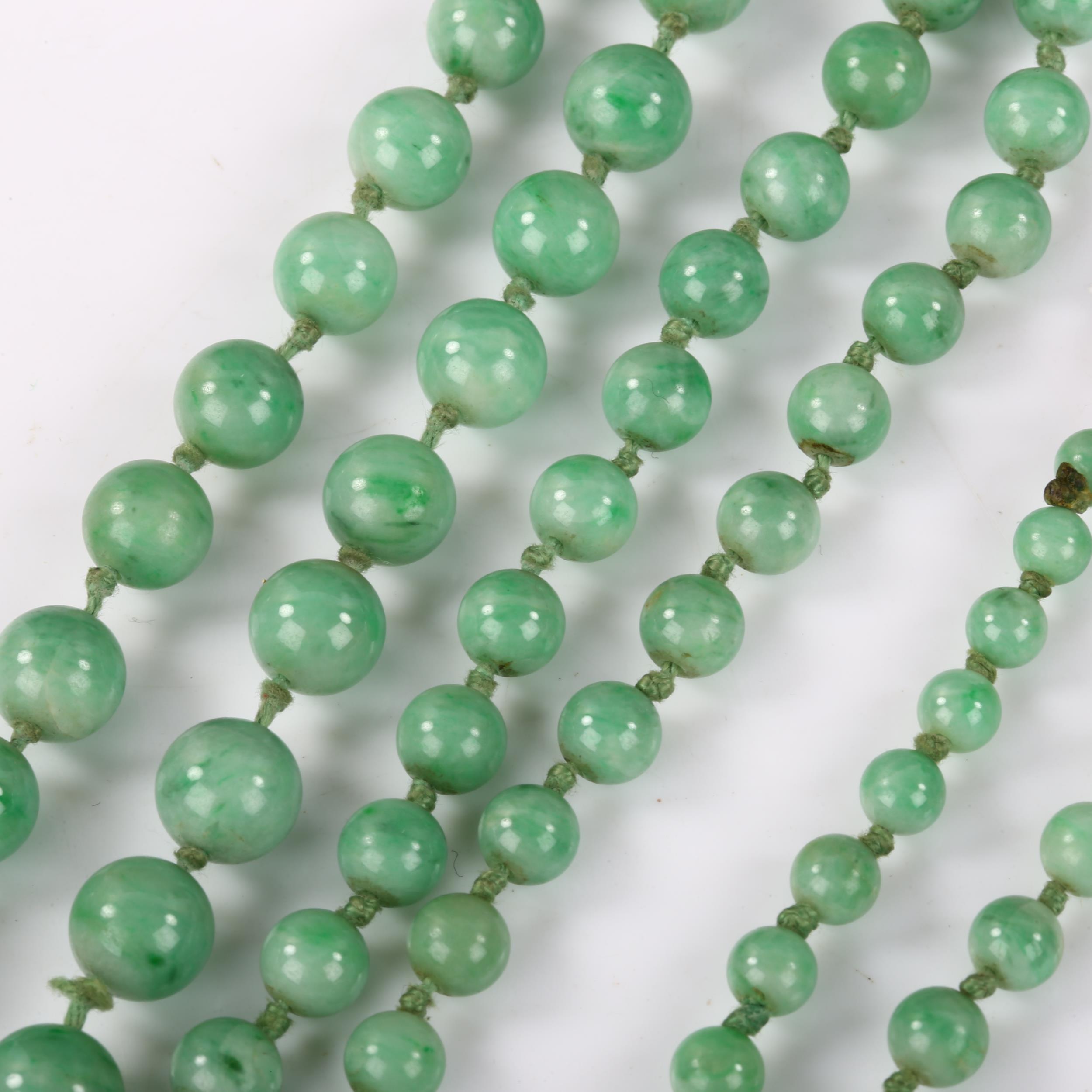 A single-strand graduated jade bead necklace, individually knotted, bead diameters 8.7mm - 4.5mm, - Image 2 of 4