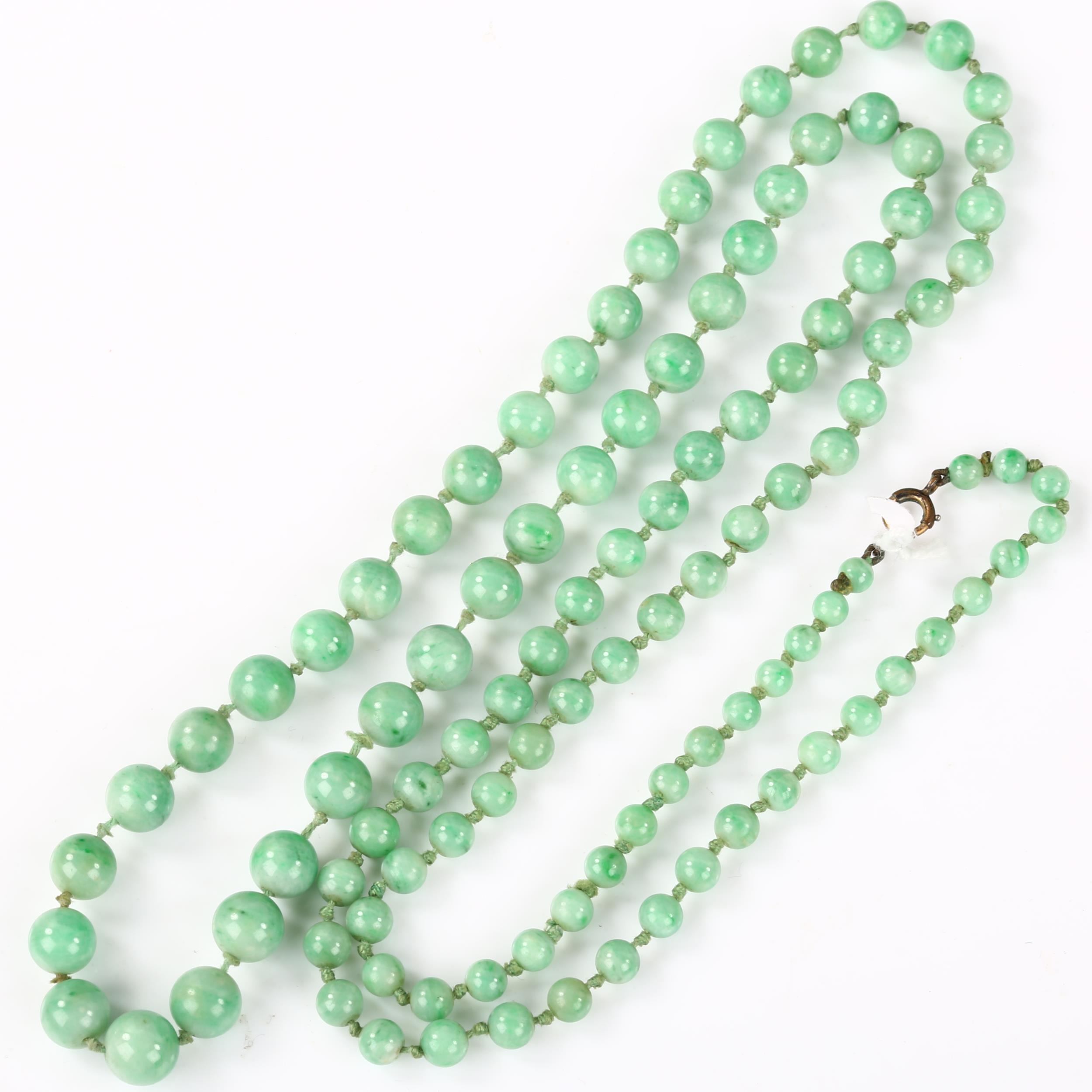 A single-strand graduated jade bead necklace, individually knotted, bead diameters 8.7mm - 4.5mm,