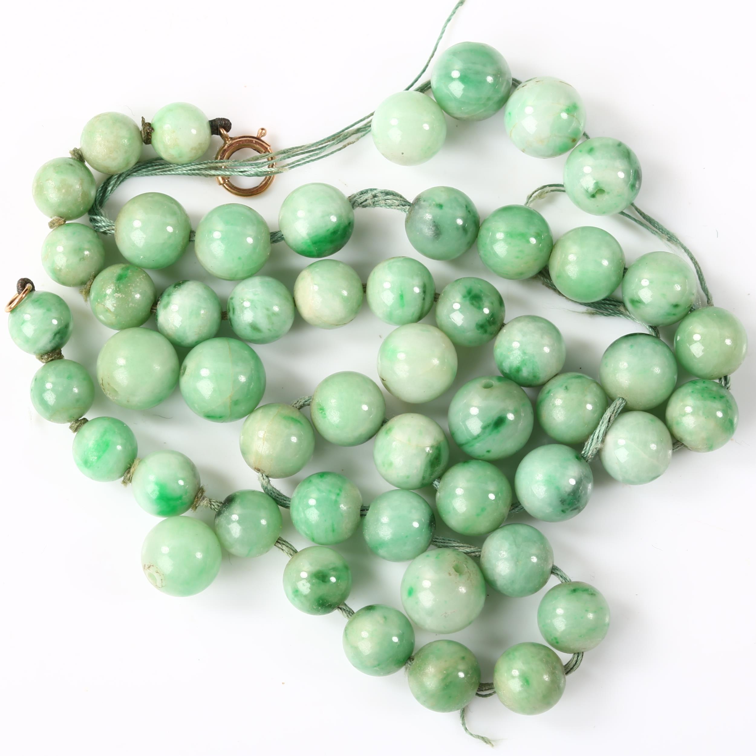 A group of graduated polished jade beads, sizes ranging from 7.04mm - 9.72mm, 49.9g total