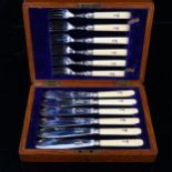 A cased set of Edwardian silver-bladed ivory-handled fish cutlery for 6 people, with engraved