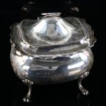 An Edwardian silver tea caddy, oval bulbous form with scalloped rim and ring handles, by Boardman,