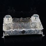 A Victorian silver desk ink stand, rectangular form, with gadrooned rim and pierced floral