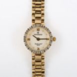 SOVEREIGN - a lady's 9ct gold and diamond quartz bracelet watch, mother-of-pearl dial with quarterly