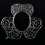 An early 20th century silver-fronted clover photo frame, pierced foliate decoration, by Henry