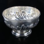 A late Victorian silver pedestal rose bowl, relief embossed half-fluted decoration, by Edward