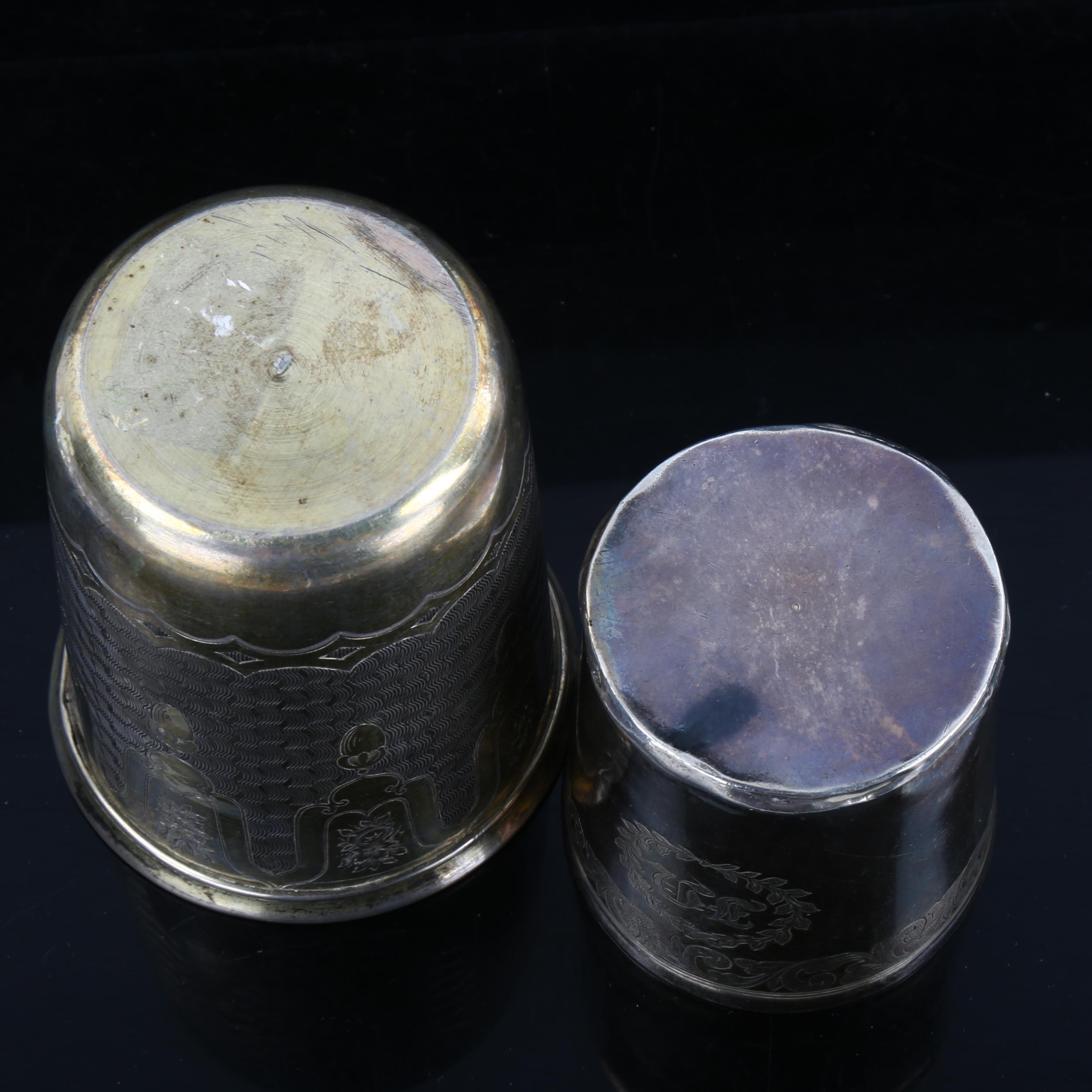 A Continental silver-gilt beaker, and a small unmarked white metal mug, largest height 8cm (2) - Image 2 of 2