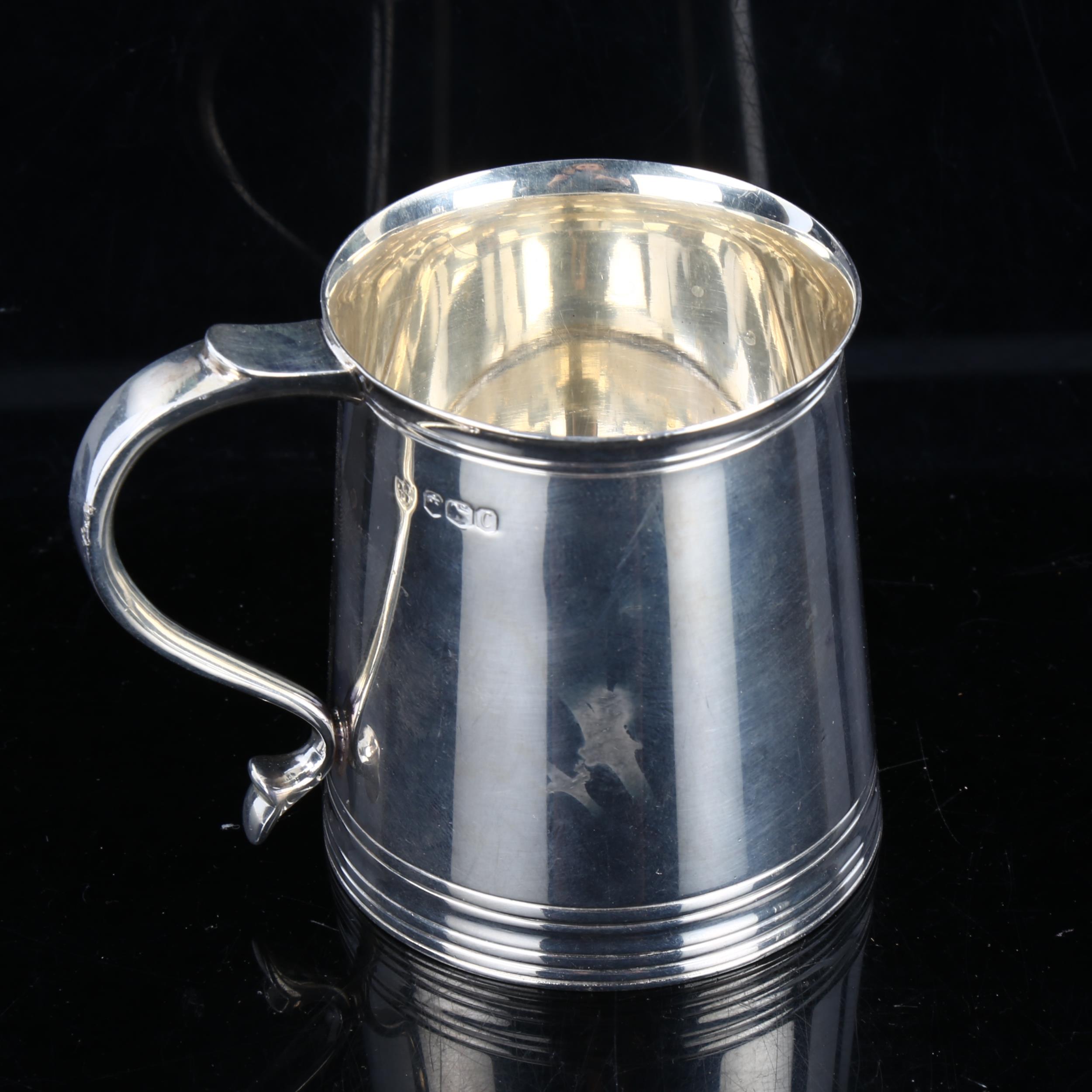 An Edwardian silver christening mug, in Charles II style, by Tessiers Ltd, hallmarks Sheffield 1920,