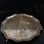 An Edward VIII silver salver, shaped and gadrooned rim on 3 feet, by Frank Cobb & Co Ltd,
