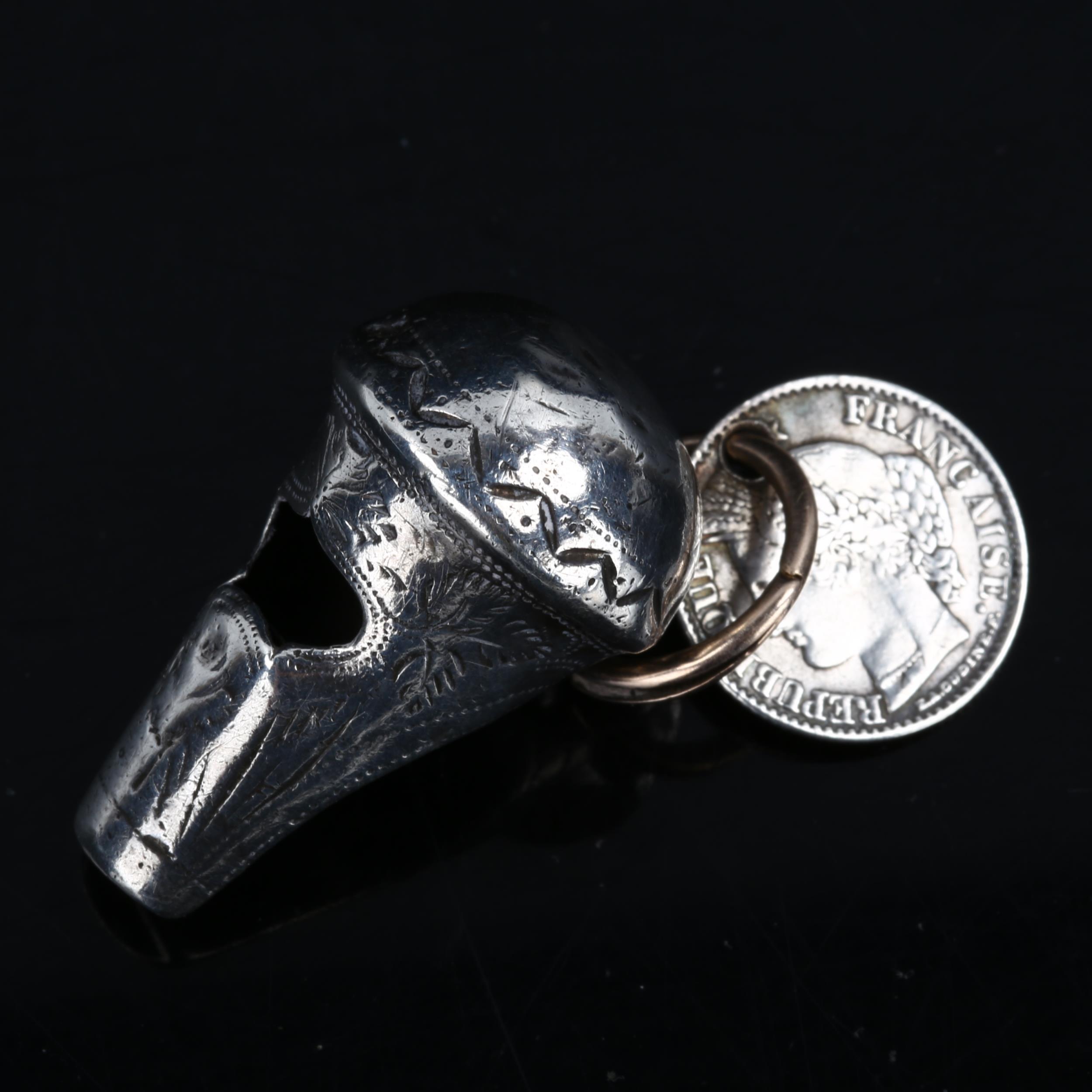 An early 19th century miniature silver whistle, bright-cut engraved decoration, maker's marks IT,